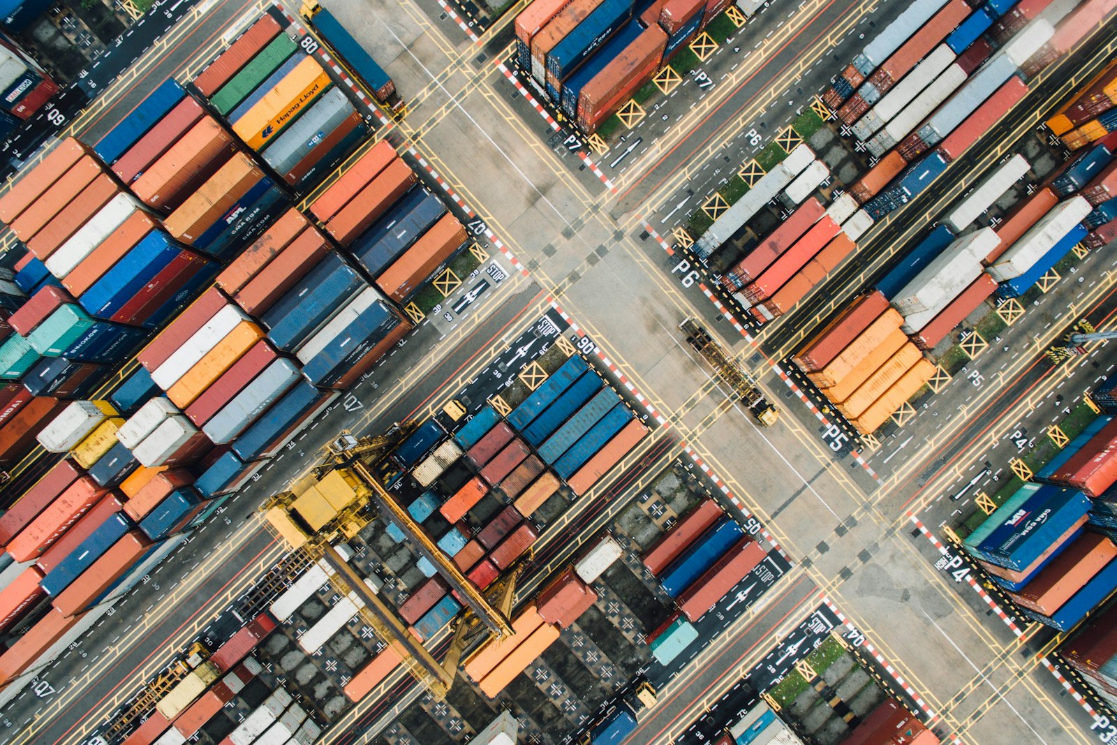 Aerial view of a container terminal with rows of shipping containers